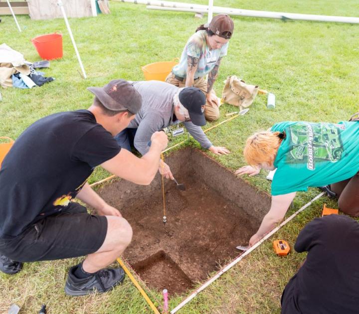 Field school participants excavating