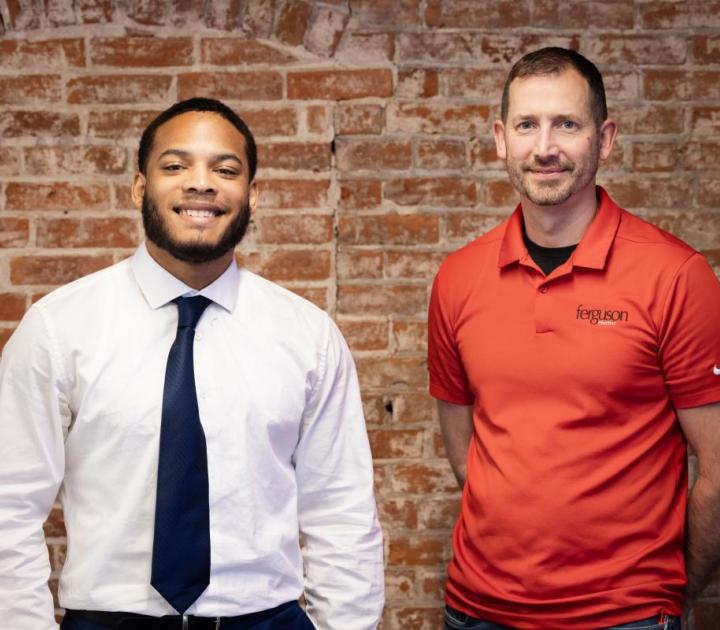 Zayron Miles, a recent Buffalo State graduate who served as a Ferguson Electric intern, and Paul Perry of Ferguson Electric